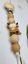 Load image into Gallery viewer, Highland Cow Beechwood Pacifier Clip, Silicone
