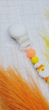 Load and play video in Gallery viewer, Candy Corn Gnome Pacifier Clip, Glow in the Dark
