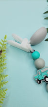 Load and play video in Gallery viewer, Turquoise &amp; Grey Truck Pacifier Clip
