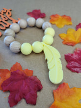 Load image into Gallery viewer, Yellow Feather Teething Ring, Silicone and Beechwood
